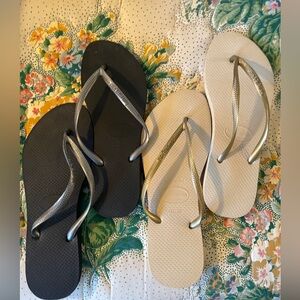 Two pairs of Havaiana’s ~ never worn. USA 9 black w/ silver & cream w/ gold!